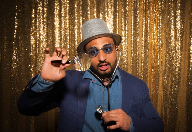istock Man enjoying party with props 1311440942