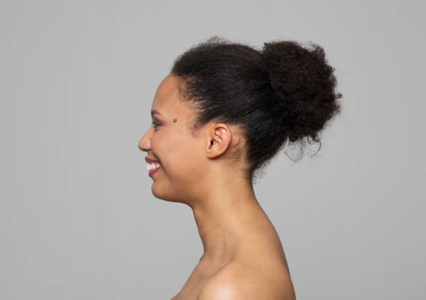 istock Side view of smiling young woman 1311440951