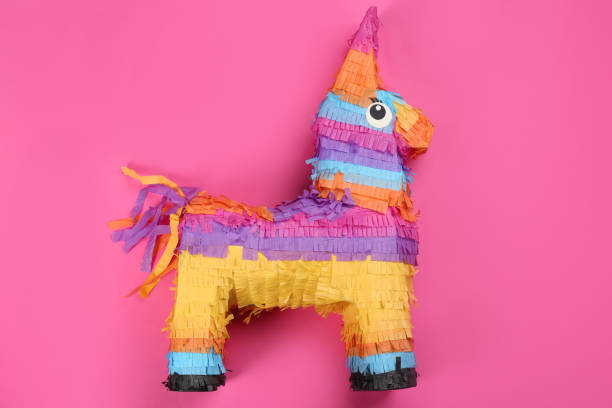 istock Bright donkey pinata on pink background, top view 1311441554