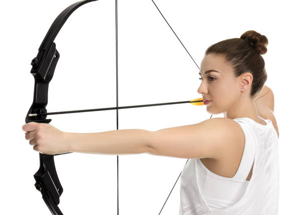 istock Woman with bow and arrow practicing archery on white background 1311442849