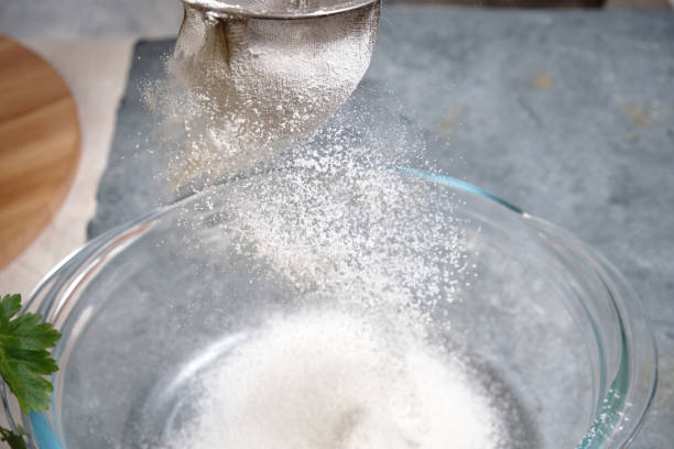 istock Flour is sieved with a metal sieve 1311443094