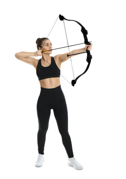 Woman with bow and arrow practicing archery on white background