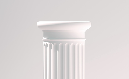 A greyscale of a column of an old Greek building under a cloudy sky and sunlight
