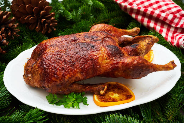 istock Whole fried duck for Christmas with side dishes 1311443969