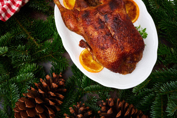 istock Whole fried duck for Christmas with side dishes 1311444150