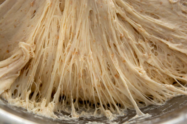 istock Dough fermented dough. Gluten structure texture close up. Baking at home, sourdough bread making. 1311444477