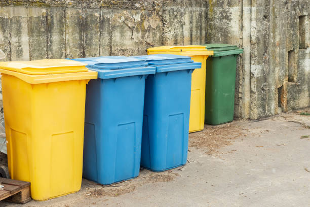 istock Blue and yellow trash cans or garbage bins 1311446215