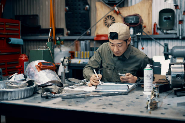 istock Mid adult male using a digital tablet in the manufacturing process 1311447675
