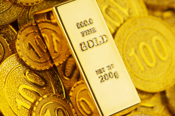 istock Gold bars and gold coins 1311448540
