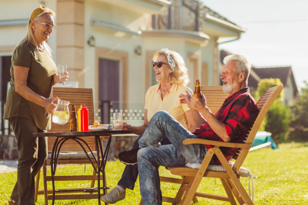 istock Senior friends having an outdoor lunch 1311448653