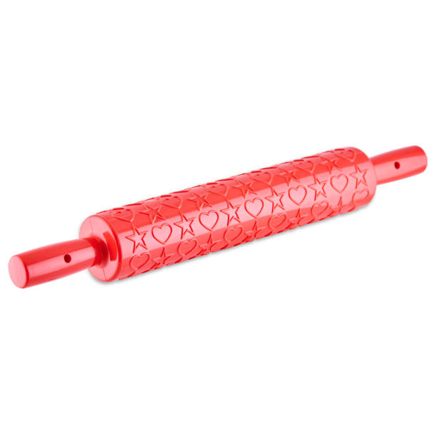 istock Red silicone rolling pin with hearts and stars isolated on white background, copy space. 1311449079
