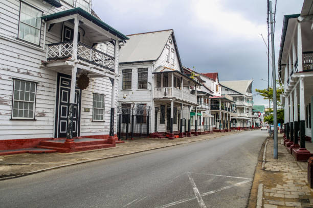 Street with old colonial buildings in Paramaribo, capital of Suriname. stock photo
