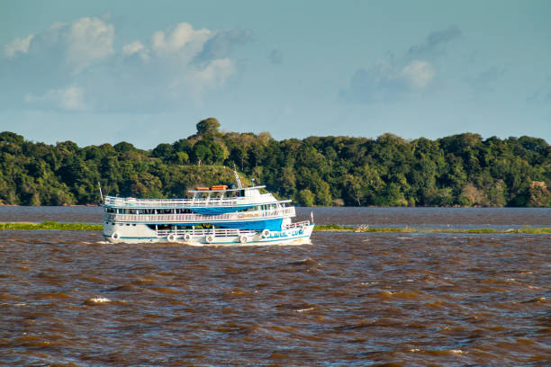 AMAZON, BRAZIL - JUNE 28, 2015: View of passenger river boat plying Amazon river, Brazil