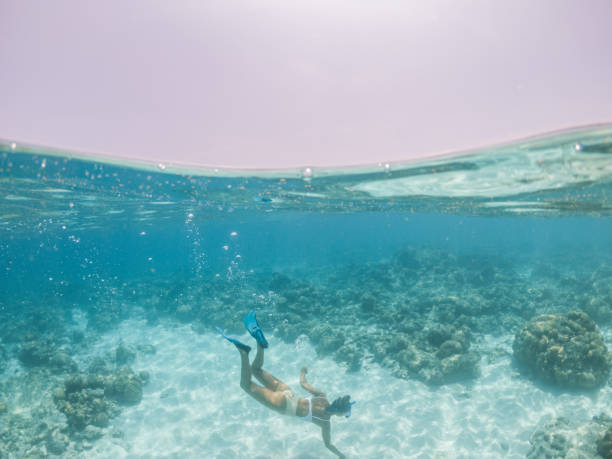 istock Woman dives underwater 1311452249