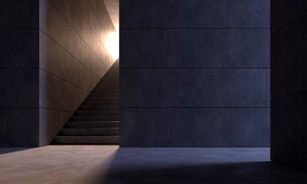 istock Dark underground space with staircase illuminated by warm light 1311452603