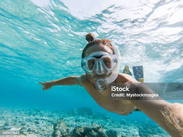 Young Man Takes Selfie Underwater With Snorkelling Mask Stock Photo - Download Image Now