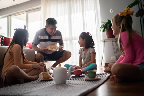 istock Father bringing some food for daughter's picnic at home 1311454909