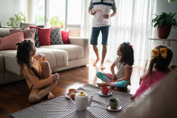 istock Father arriving at daughter's picnic at home 1311455610