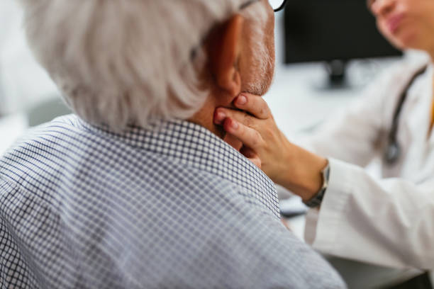 istock Female doctor examining a senior patient 1311456630