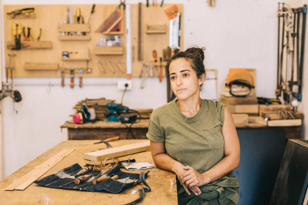 istock Young woman daydreaming at work 1311459624