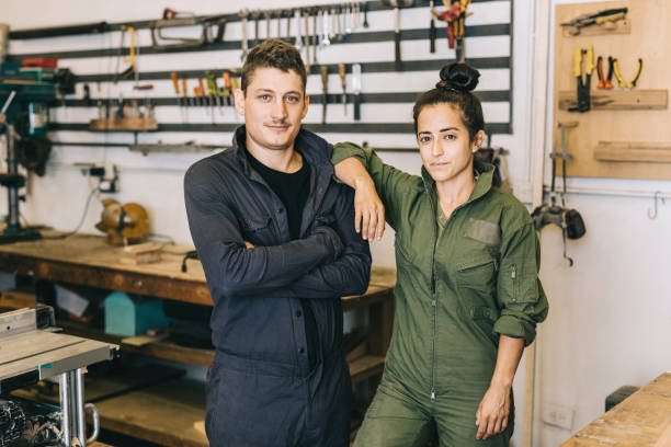istock Portrait of coworkers in workshop 1311459675