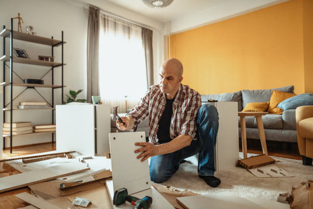 istock Man using electric equipment and tools at home 1311461839