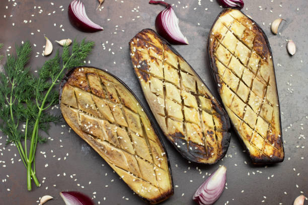 istock Baked eggplant with onions, garlic and sesame seeds. 1311462833
