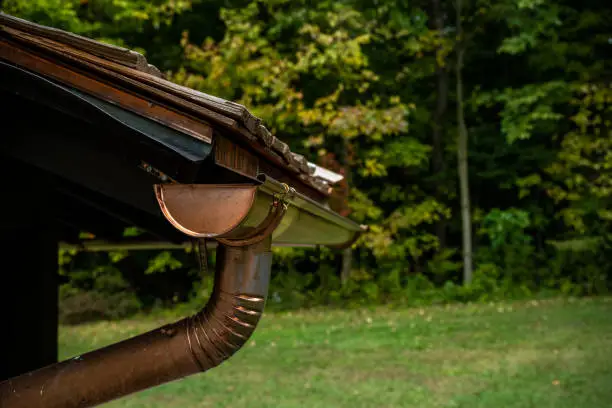 Photo of Copper Gutters Along Woodend Shake Roofline