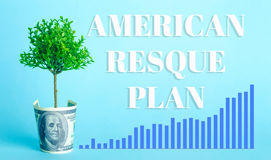 USA dollars background. American rescue plan, USA relief program, stimulus check and Act of 2021 concept. Money, business, profit and livelihood idea. High quality photo