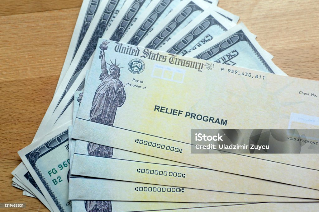 USA dollars background. American rescue plan, USA relief program, stimulus check and Act of 2021 concept. Money, business, profit and livelihood idea USA dollars background. American rescue plan, USA relief program, stimulus check and Act of 2021 concept. Money, business, profit and livelihood idea. High quality photo Relief Carving Stock Photo