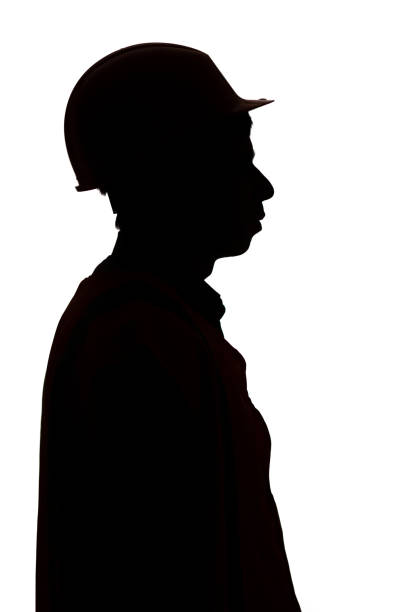 istock silhouette profile of builder in hard hat on white background, male profession concept 1311470090