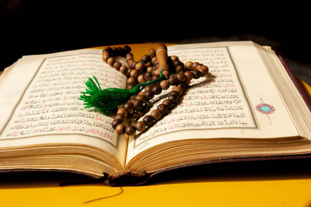 istock an open Quran book and prayer beads on its pages 1311472243