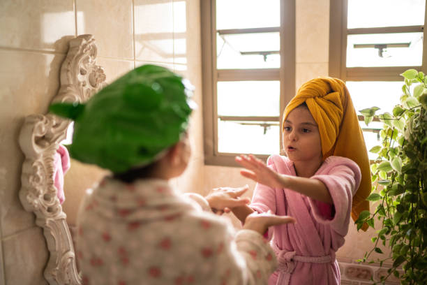 istock Girls playing clapping game after shower 1311472523