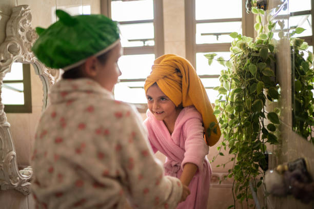 istock Girls in the bathrrom after shower 1311472524