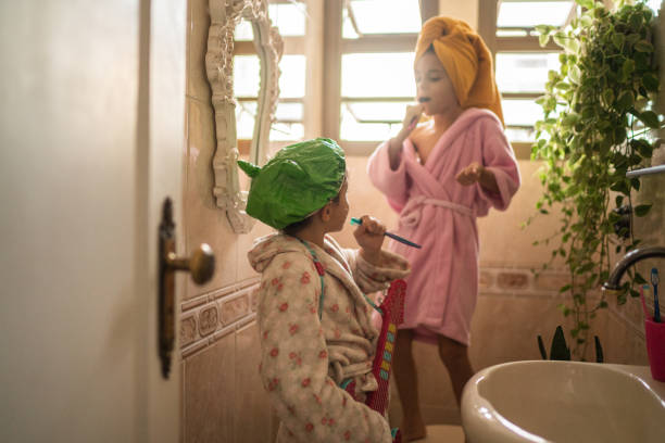 Sisters singing in the bathroom after bath