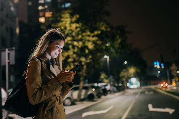 istock A young woman using her cellphone while out in the city 1311474514