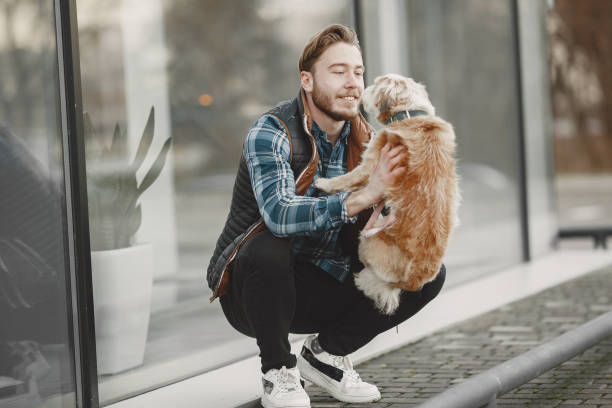 istock Man with a dog in a city 1311474718