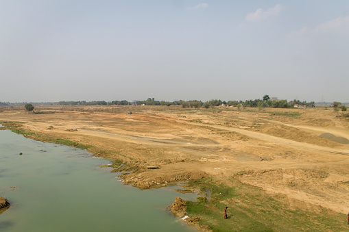 Curved river bank in a rural area of West Bengal, in India.