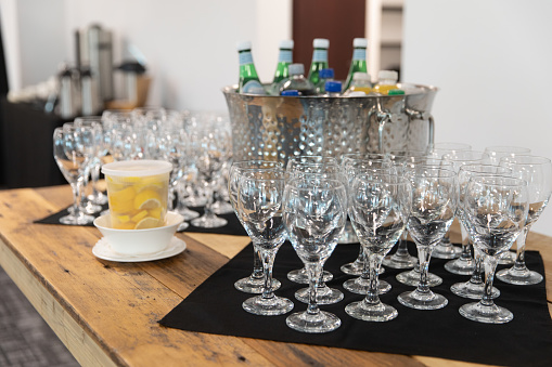 glasses with a choice of beverage being served at a party
