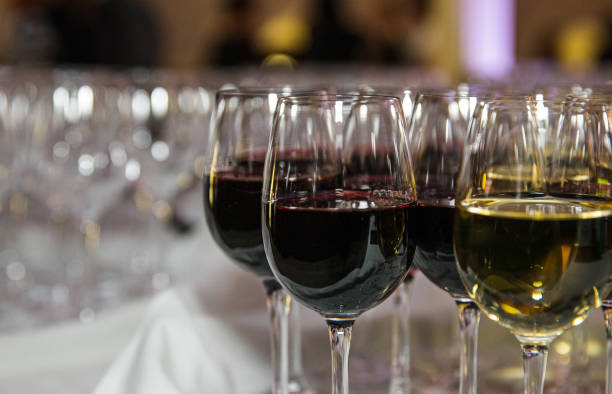 istock bunch of wine glasses on a counter 1311478260