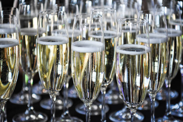 istock bunch of champagne glasses on a counter 1311478905