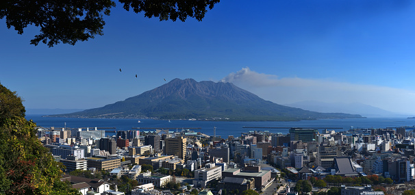 The iconic snow capped cone of Mt. Fuji overlooking the crowded cityscape and skyscrapers of downtown Tokyo, Japan's vibrant capital city. ProPhoto RGB profile for maximum color fidelity and gamut.