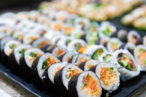 rolled and sliced seafood served at an event with healthy ingredients