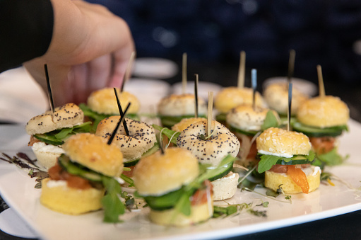 bunch of fresh mini burgers made with bagel bread