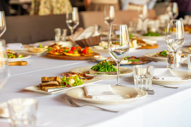 decorated banquet with salads A decorated banquet table with appetizers awaiting guests food and beverage industry stock pictures, royalty-free photos & images