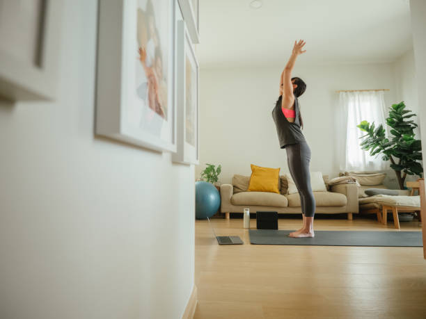 istock Asian female exercising at home. 1311489667