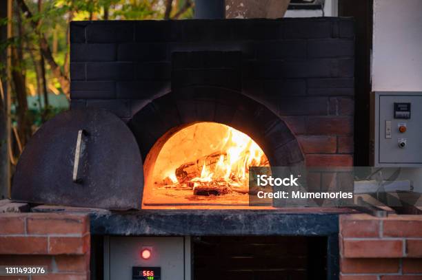 Firewood Burning In Pizza Stove At Pizzeria Stock Photo - Download Image Now - Oven, Barbecue Grill, Stone - Object