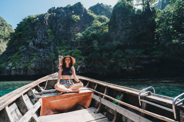 istock Young woman on a longtail boat in Thailand, Phi Phi Island 1311496593