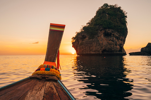 Admiring the sunset on a long tail boat at Phi Phi Island, Thailand