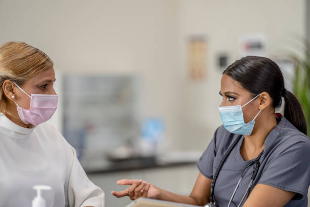 istock Masked Medical Appointment 1311500892